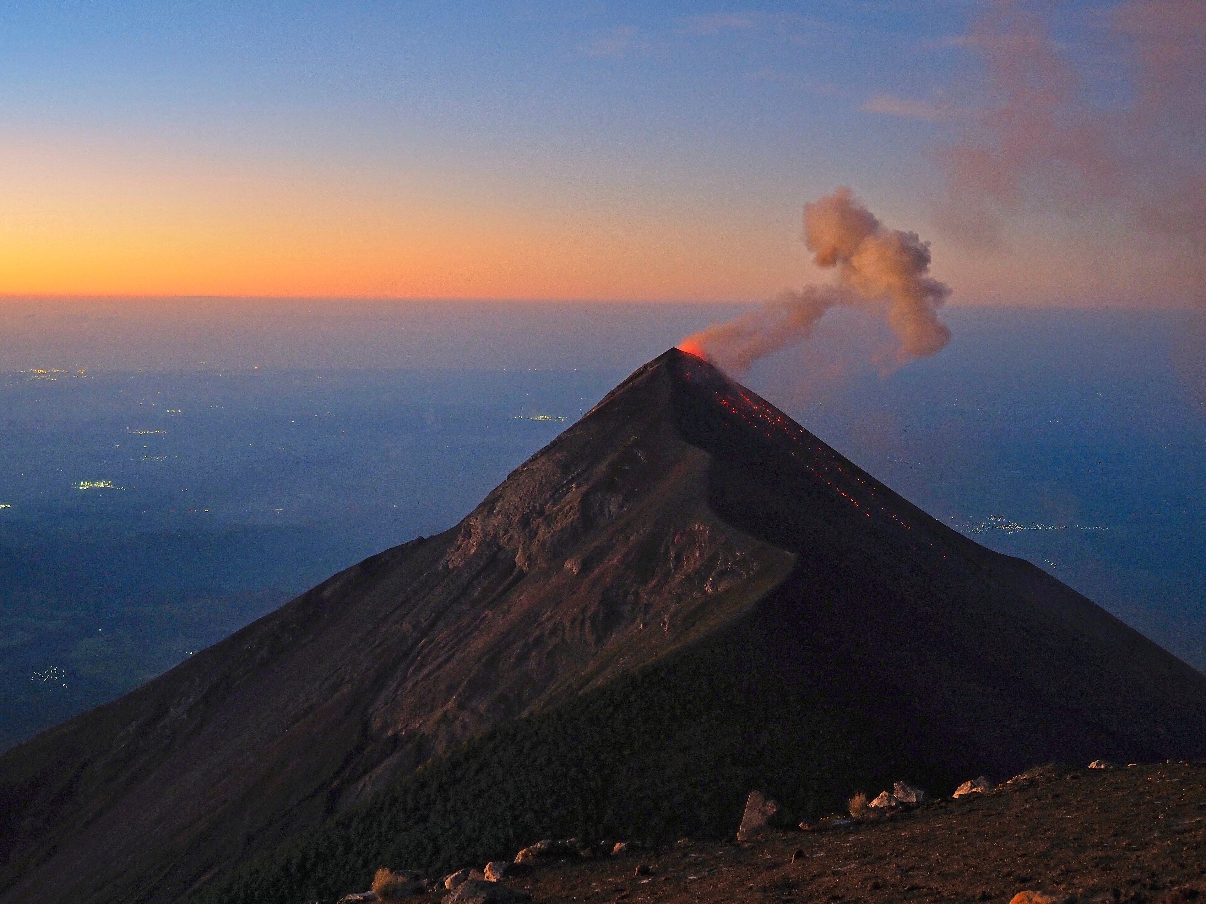 Volcán de Fuego erupting at dawn, seen from Acatenango, Guatemala