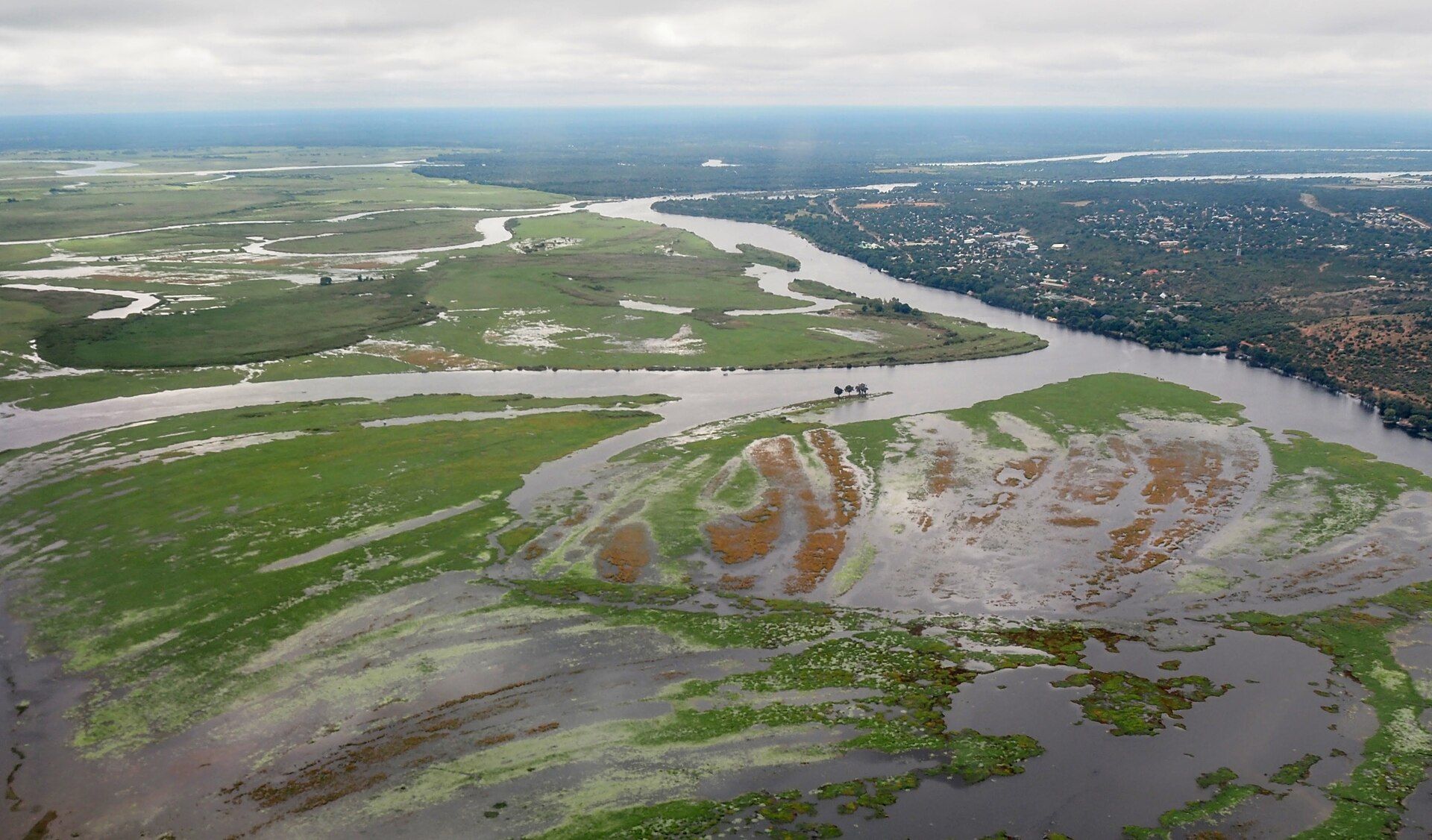 Aerial view of the Chobe River and its green floodplains beside Kasane, northern Botswana