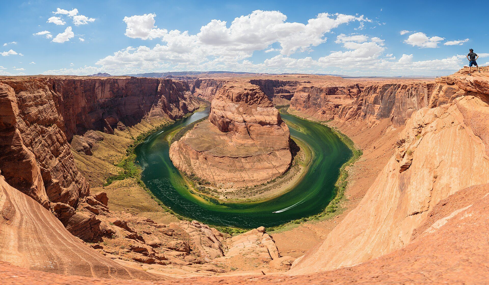 The Colorado River curving around a sandstone butte at Horseshoe Bend, Arizona, seen from the canyon rim